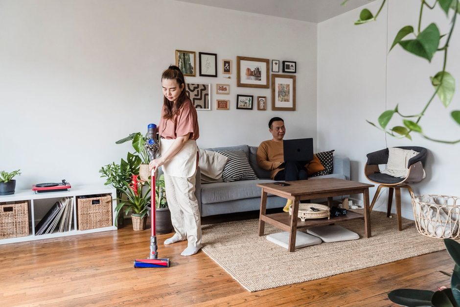 Photo by Annushka Ahuja on Pexels Woman vacuuming the floor of a bright living room with sofa and plants. Photo by Annushka Ahuja on Pexels