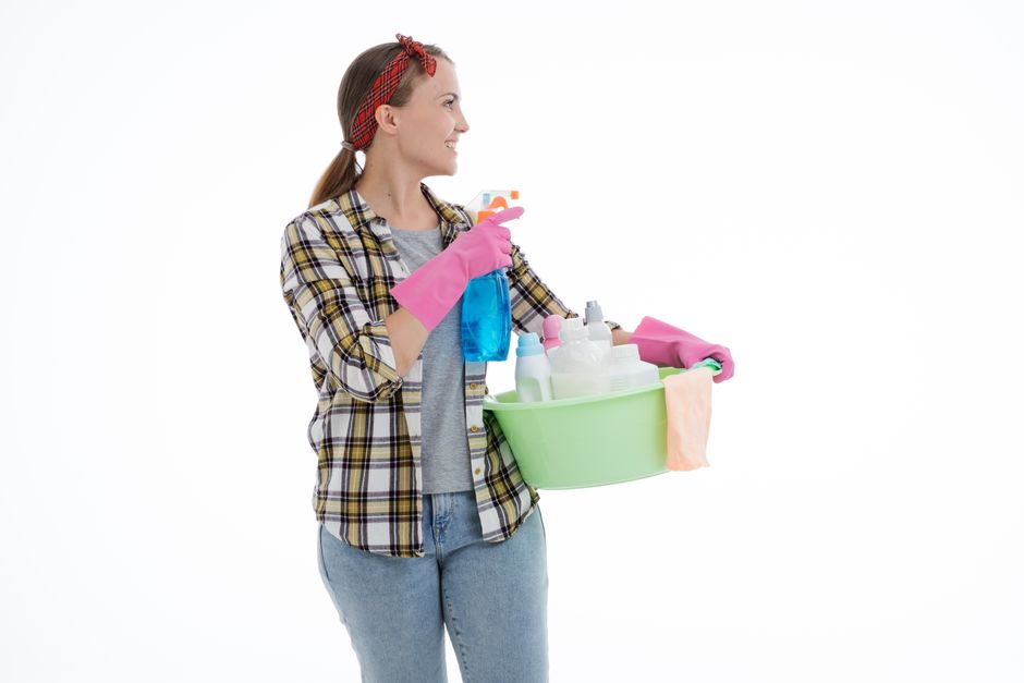 Photo by Anastasiya Gepp on Pexels Woman holding cleaning supplies in a studio shot with a white background. Perfect for housekeeping themes. - Photo by Anastasiya Gepp on Pexels