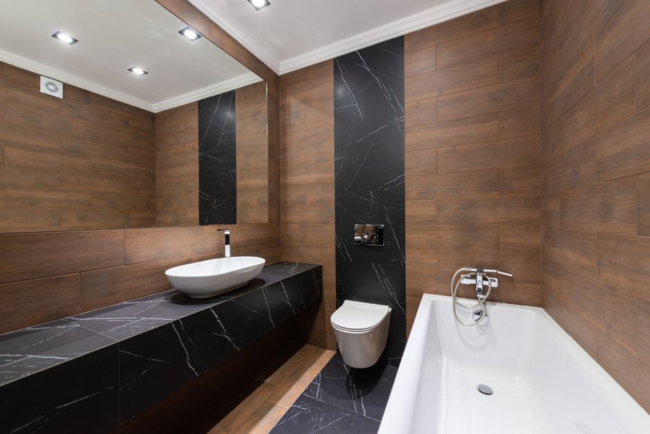 Photo by Max Vakhtbovych on Pexels Modern bathroom with wooden accents, sleek fixtures, and minimalist design.