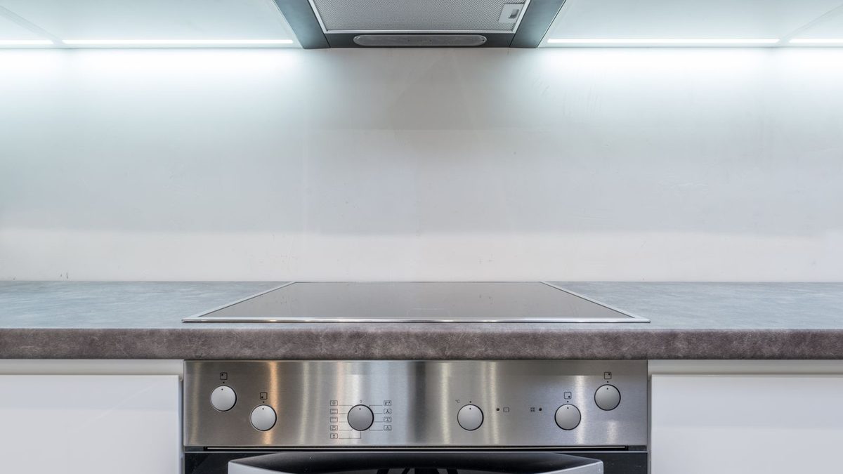 Kitchen extractor hood above stove and oven under bright lighting. Photo by Max Vakhtbovych on Pexels