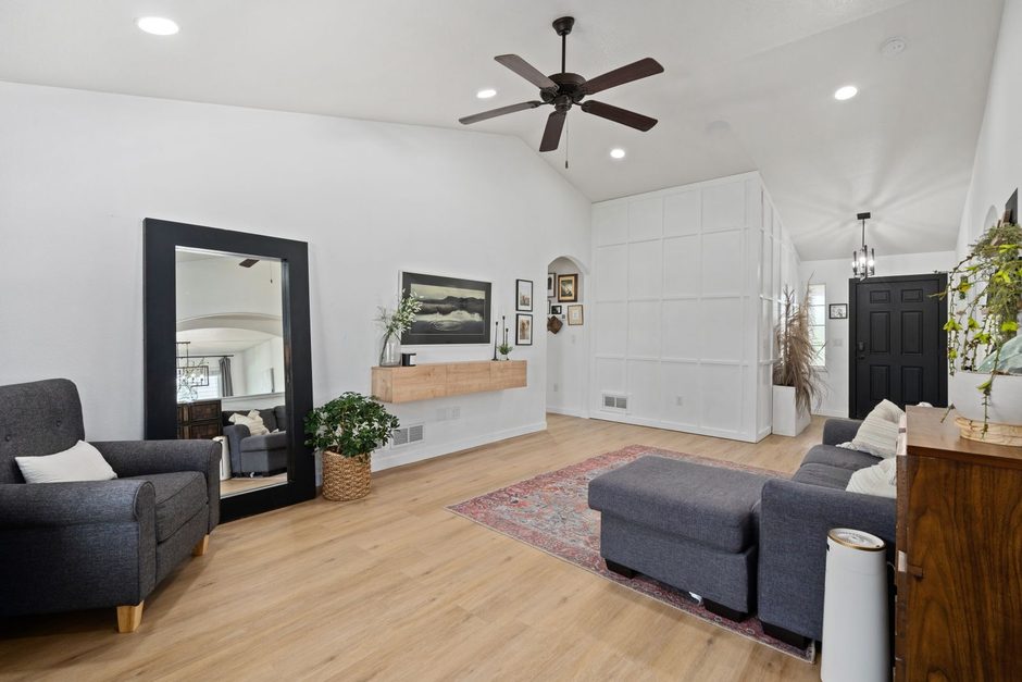 Photo by hi room on Pexels Modern living room with black ceiling fan above grey sofa and wooden floor. Photo by hi room on Pexels