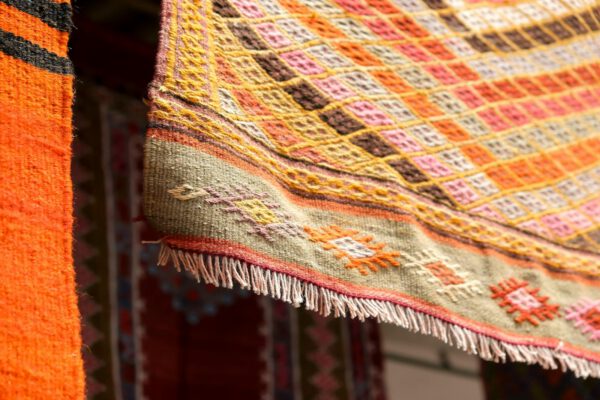 Vibrant Turkish rug showcasing intricate patterns in Bergama, İzmir, Türkiye.