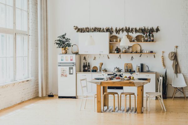 Bright and airy kitchen with minimalist design, featuring wood accents and natural light.