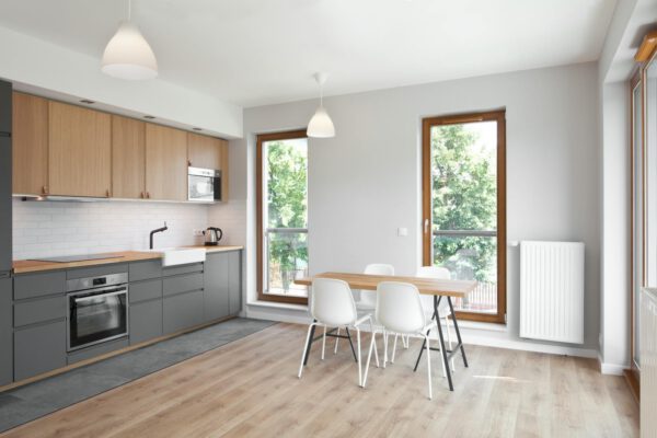 Sleek kitchen interior featuring wood elements and natural lighting.