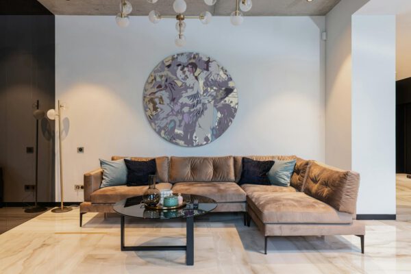 Elegant minimalist living room with modern decor and luxury seating arrangement.