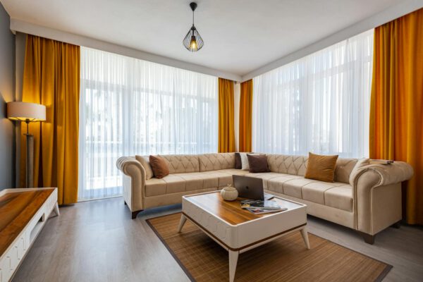Modern living room featuring minimalist furniture and warm lighting.