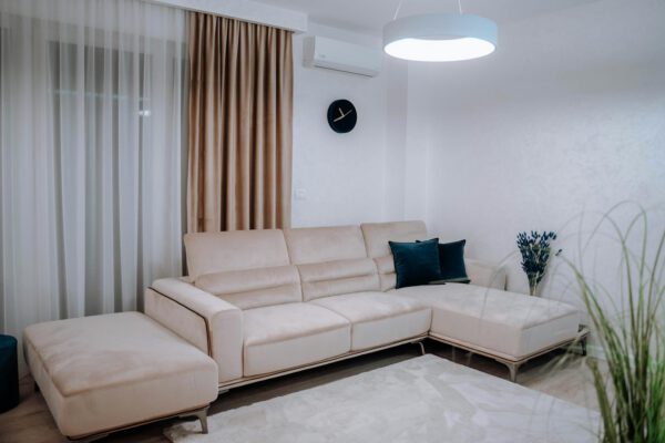 Contemporary living room with a beige sectional sofa