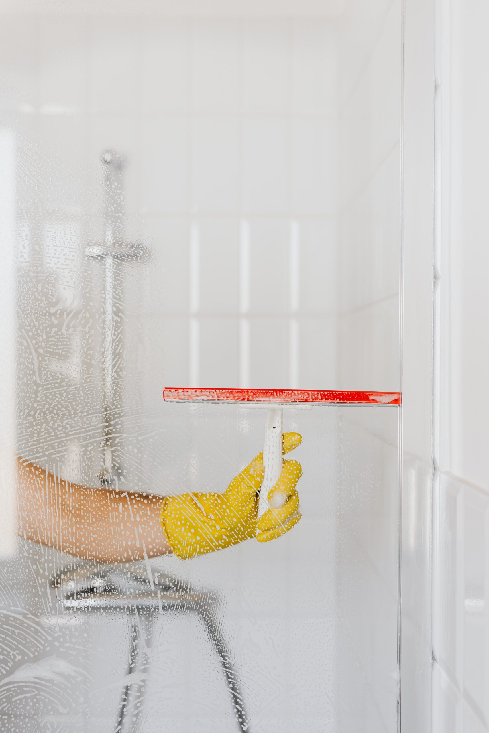 Professional cleaner preparing a rental kitchen for bond inspection in Singapore